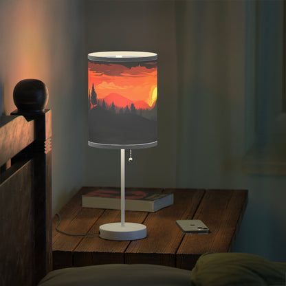 Sunset Silhouette - Lamp captures indoor sunset magic. With a realistic print of mountains and sunset, it bathes rooms in inviting hues. Radiant yet calming, its soft glow mimics natural sunsets, perfect for winding down. The lamp's 20" × 7" size, solid white steel base, and versatile design make it a charming addition to side tables, work desks, or nightstands.