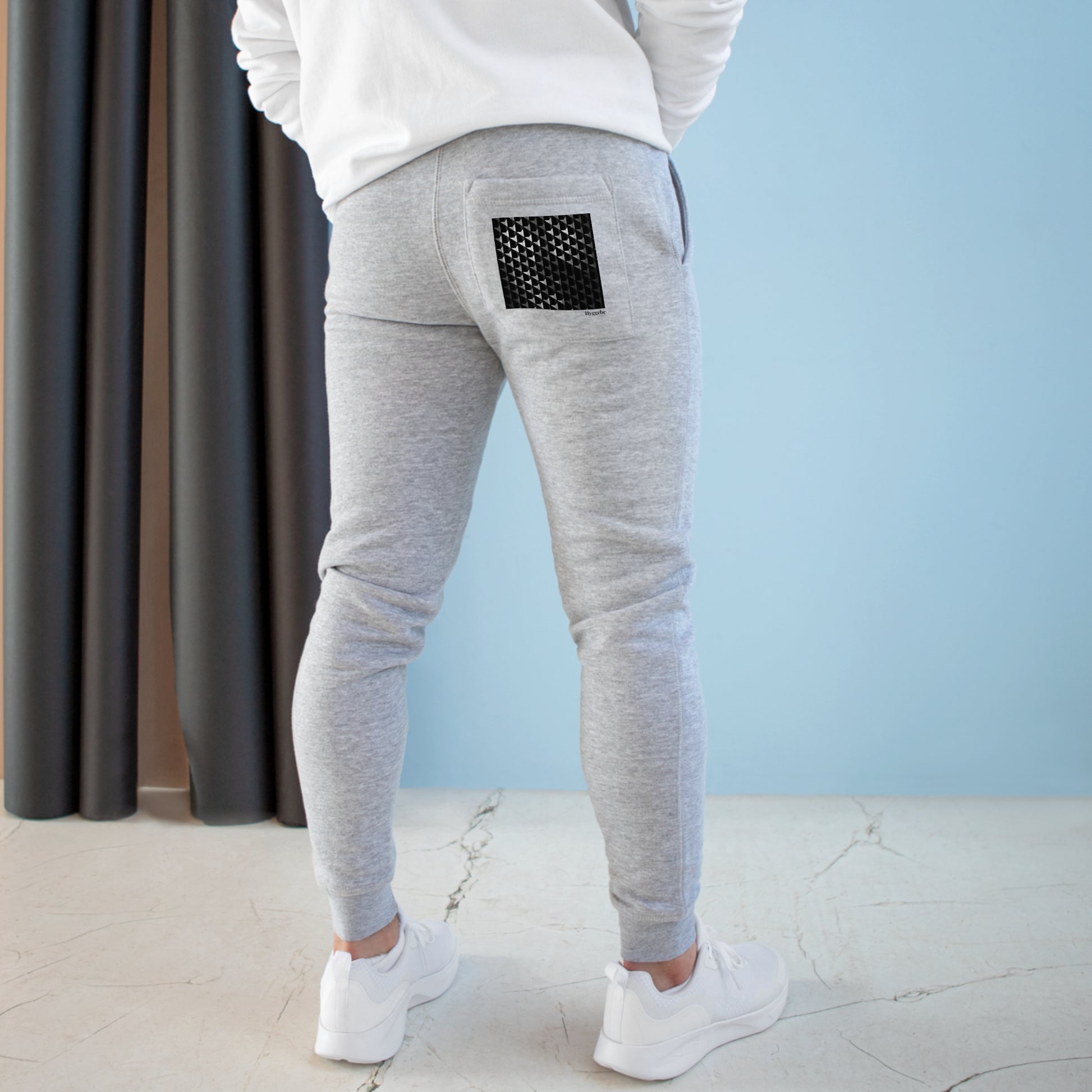 Snug Slate - Premium Fleece Joggers offer both comfort and style. Crafted from 80% combed ringspun cotton and 20% recycled polyester, these joggers prioritize softness, durability, and sustainability. With a cozy 3-end fleece lining, they're perfect for indoor and outdoor relaxation. The slim-tapered fit, ribbed waistband, and pockets make them versatile for lounging or a quick run.