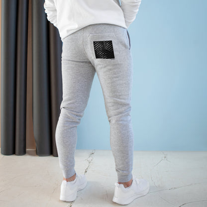 Snug Slate - Premium Fleece Joggers offer both comfort and style. Crafted from 80% combed ringspun cotton and 20% recycled polyester, these joggers prioritize softness, durability, and sustainability. With a cozy 3-end fleece lining, they're perfect for indoor and outdoor relaxation. The slim-tapered fit, ribbed waistband, and pockets make them versatile for lounging or a quick run.