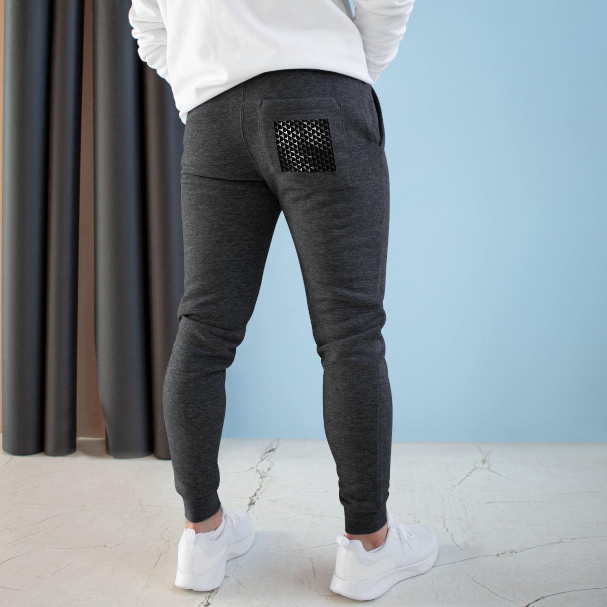 Elevate your comfort with Midnight Charcoal - Premium Fleece Joggers. Crafted from 80% combed ringspun cotton and 20% recycled polyester, they combine softness and durability. The medium-heavy fabric provides cozy warmth without excess weight, perfect for lounging or a spontaneous run. Designed with a slim-tapered fit and featuring side and back pockets, these joggers offer both style and functionality in one.