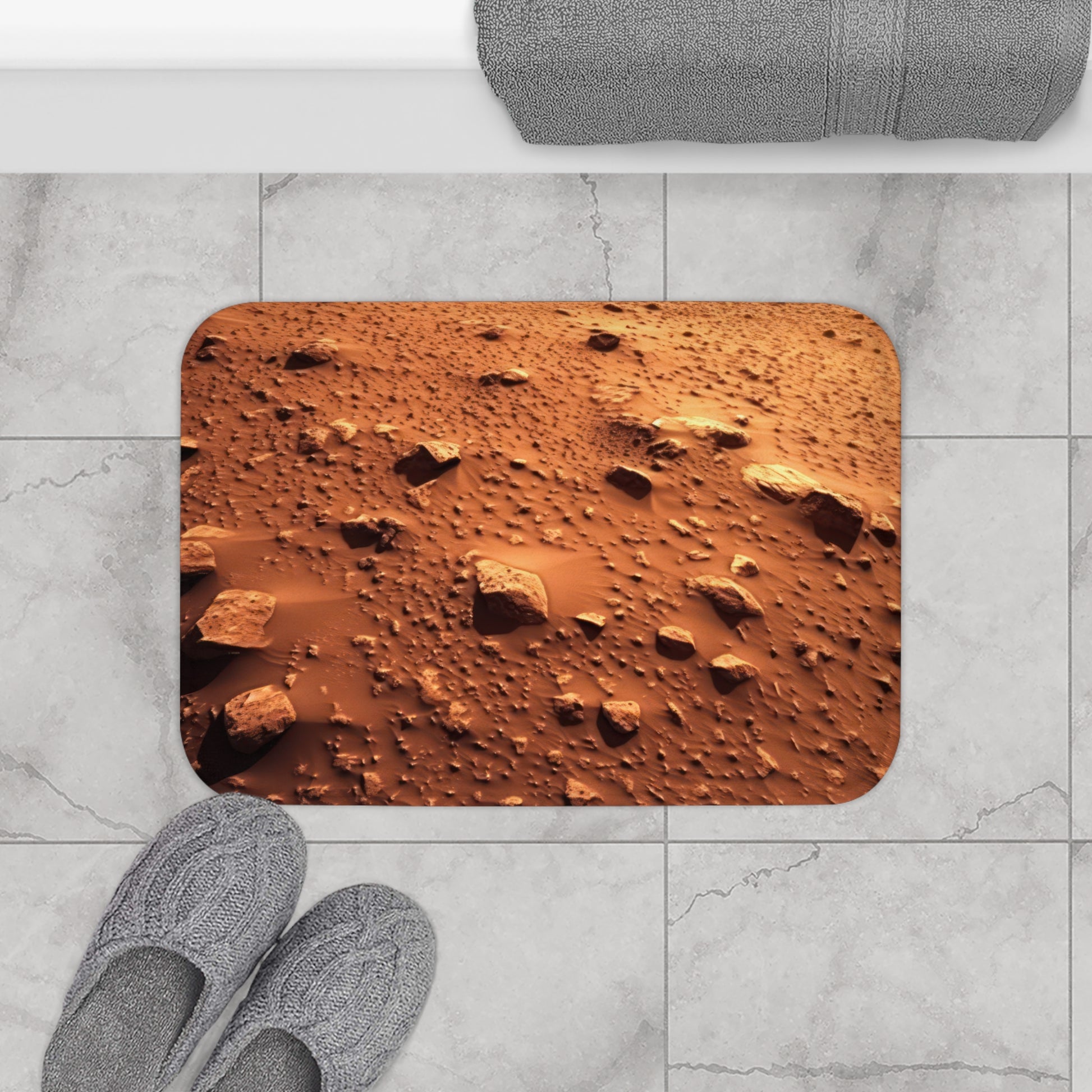 Elevate your bathroom decor to interplanetary levels with Walking On Mars - Bath Mat. Featuring a captivating Mars surface graphic on durable 100% microfiber, it adds an otherworldly touch. The anti-slip backing ensures stability, and the bound edges guarantee longevity.