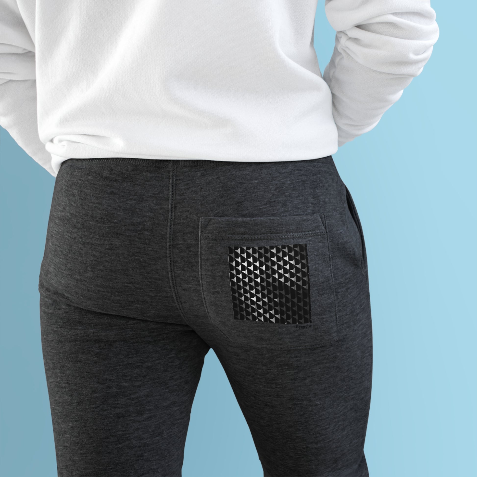 Elevate your comfort with Midnight Charcoal - Premium Fleece Joggers. Crafted from 80% combed ringspun cotton and 20% recycled polyester, they combine softness and durability. The medium-heavy fabric provides cozy warmth without excess weight, perfect for lounging or a spontaneous run. Designed with a slim-tapered fit and featuring side and back pockets, these joggers offer both style and functionality in one.